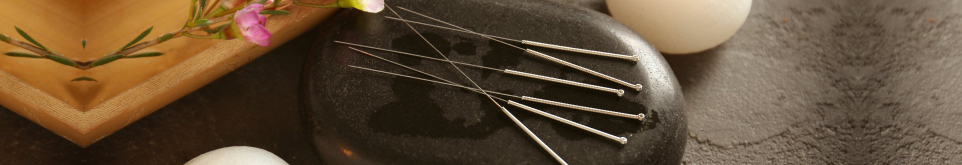 Acupuncture needles with stone and candles